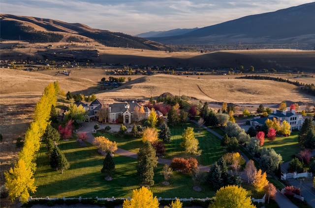 drone / aerial view with a mountain view and a rural view