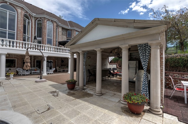 surrounding community featuring a patio and a gazebo