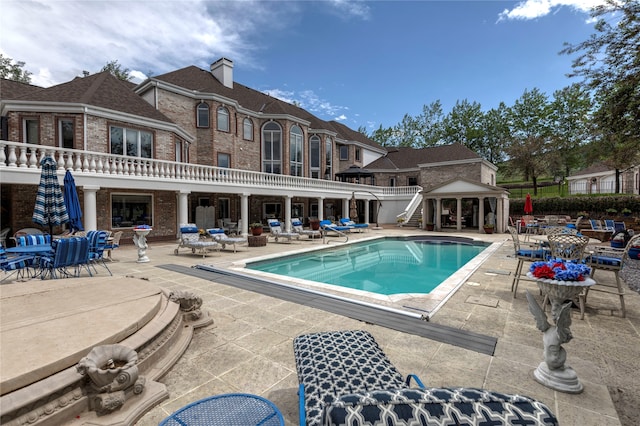 view of pool featuring a patio