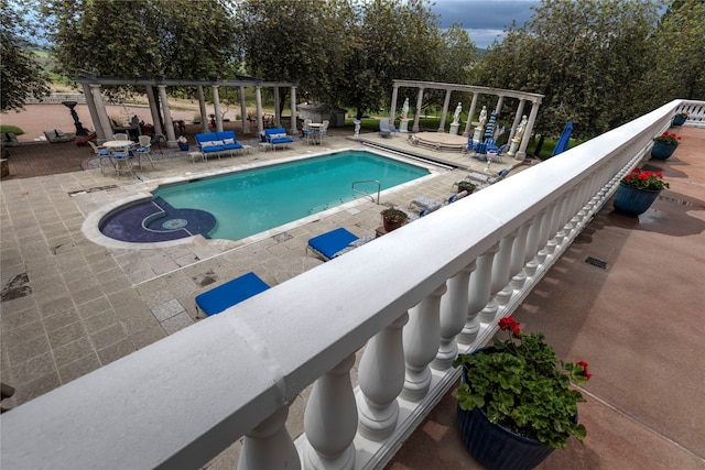 view of swimming pool with a patio