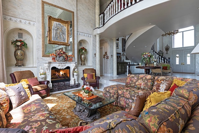 living room featuring tile flooring and ornate columns