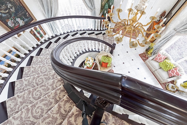 interior space with a notable chandelier and tile flooring