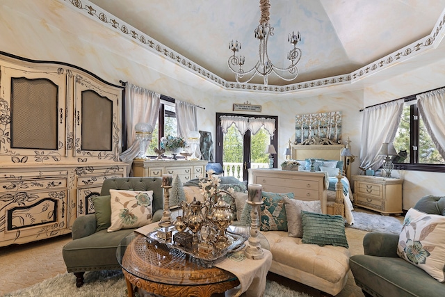 living room with a chandelier and a tray ceiling