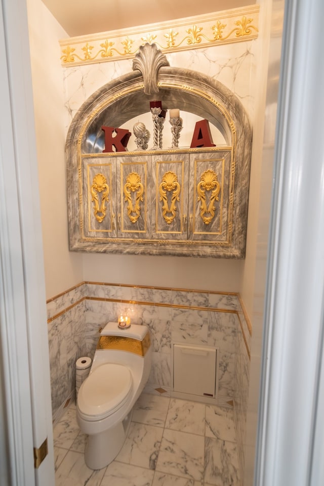 bathroom with toilet and tile flooring