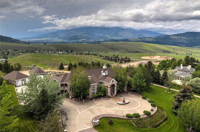 birds eye view of property featuring a mountain view and a rural view