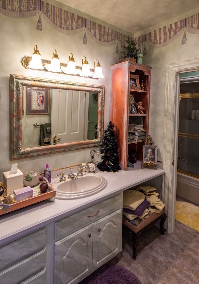 bathroom with vanity and tile flooring