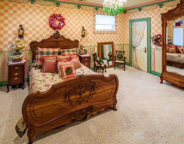 carpeted bedroom with a notable chandelier