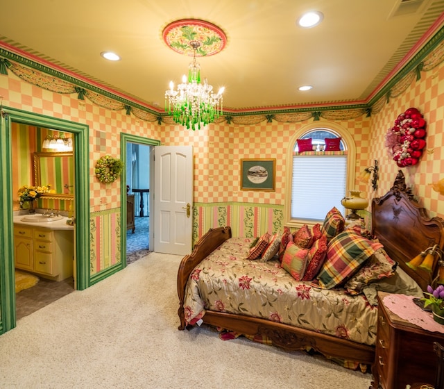 bedroom with light carpet, connected bathroom, and a chandelier