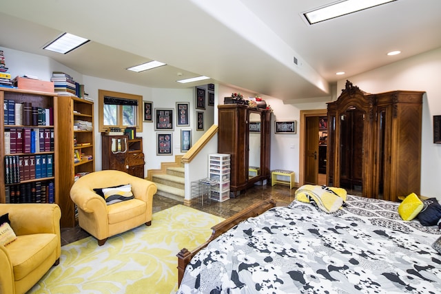 bedroom with dark tile floors