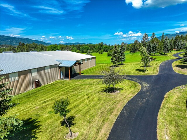 drone / aerial view with a mountain view and a rural view