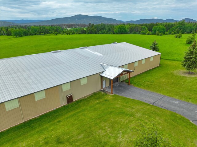 drone / aerial view with a water and mountain view