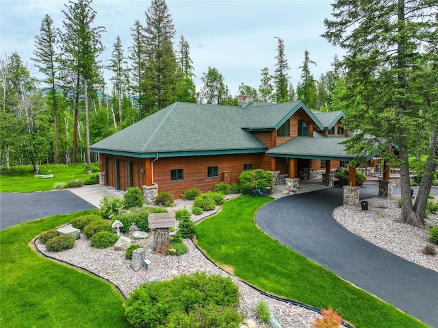 view of front of property with a front lawn and a carport