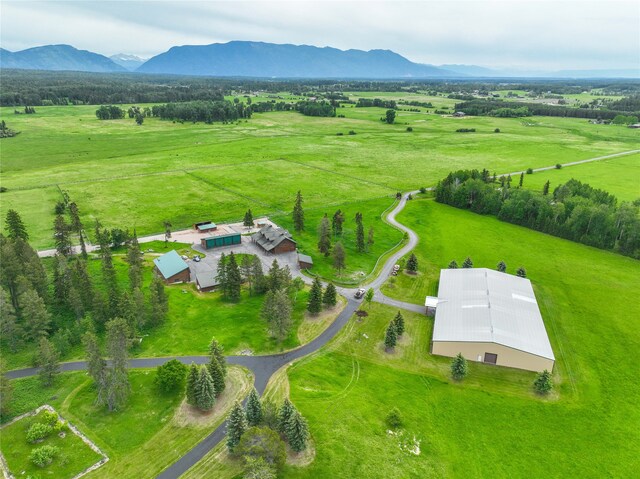 surrounding community with a gazebo, a deck with water view, and a lawn