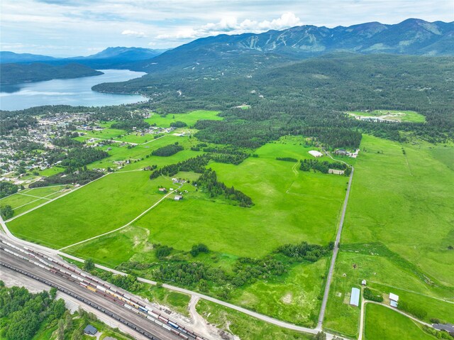 bird's eye view with a water and mountain view