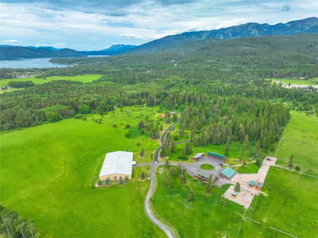 aerial view featuring a water and mountain view