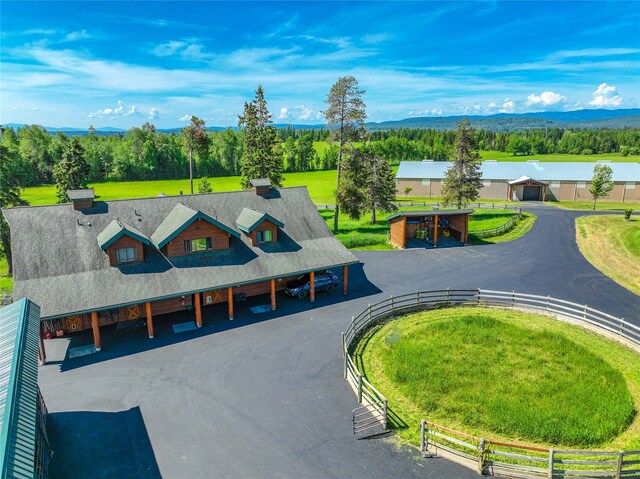 birds eye view of property with a rural view