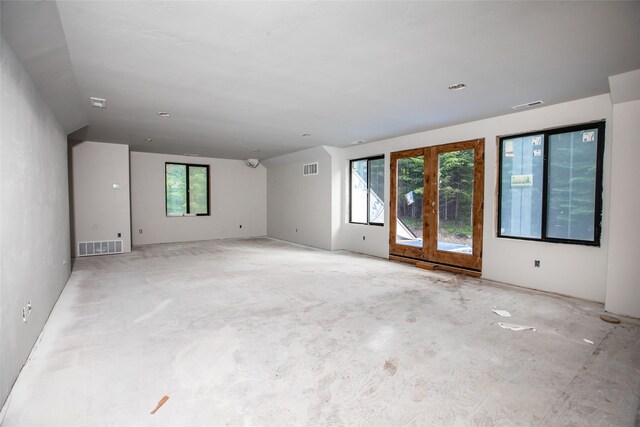 empty room with french doors and plenty of natural light