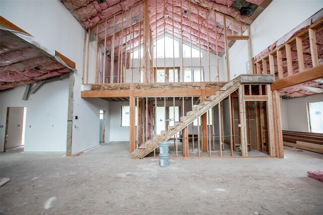 misc room with a towering ceiling