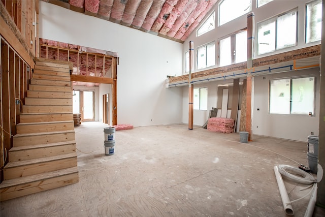 misc room featuring high vaulted ceiling and a healthy amount of sunlight