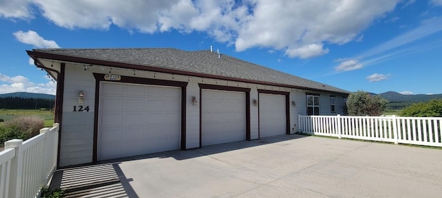 garage featuring a mountain view