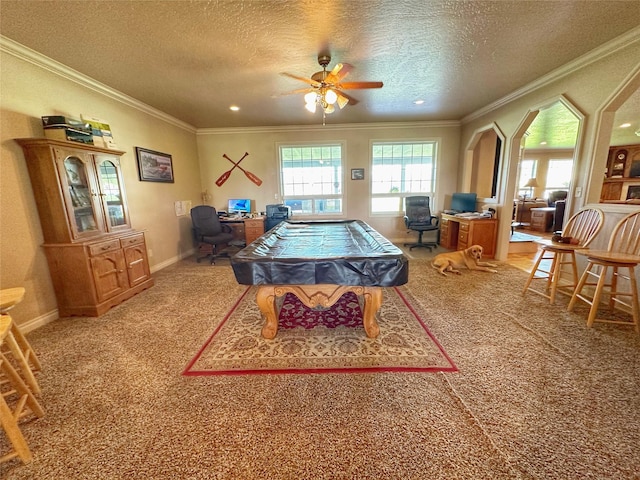 rec room with carpet flooring, a textured ceiling, ceiling fan, crown molding, and billiards