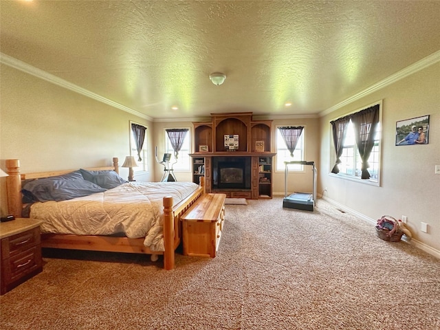 bedroom with crown molding, carpet floors, and a textured ceiling