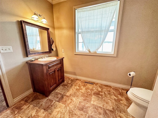 bathroom featuring vanity and toilet