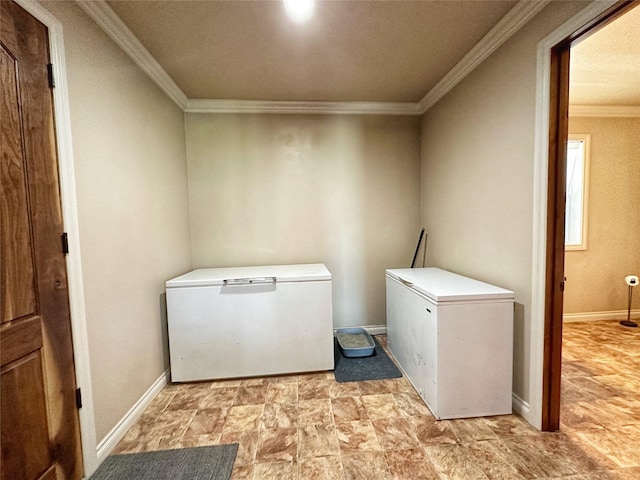 laundry room with separate washer and dryer and crown molding