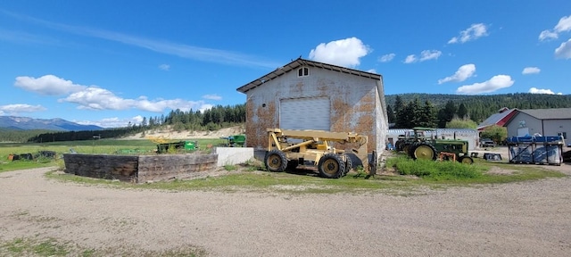 view of outbuilding with a mountain view and a garage