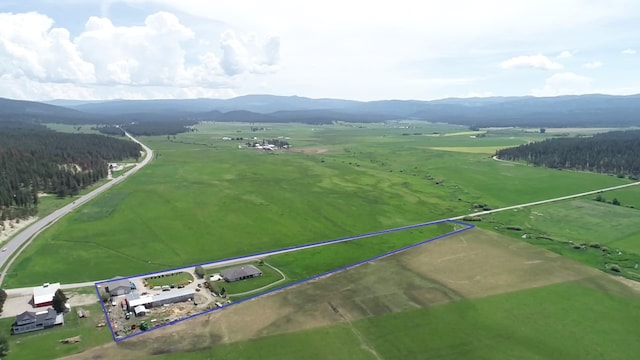 bird's eye view with a mountain view and a rural view