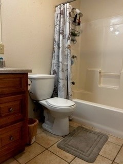 full bathroom featuring tile floors, toilet, shower / bath combo, and vanity