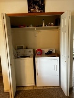 clothes washing area with hookup for a washing machine, carpet floors, and washer and dryer