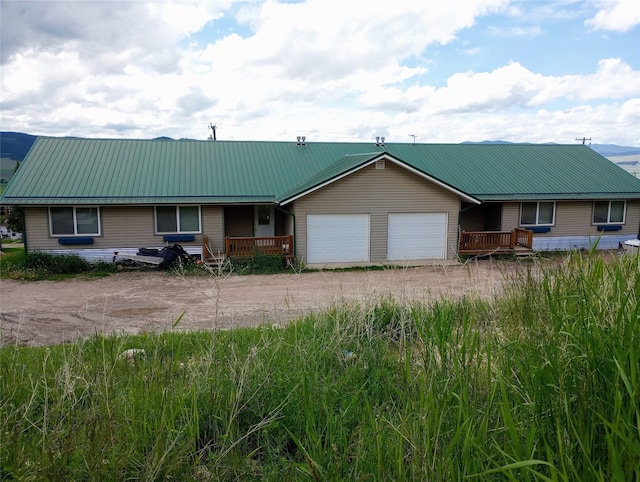 ranch-style house featuring a garage