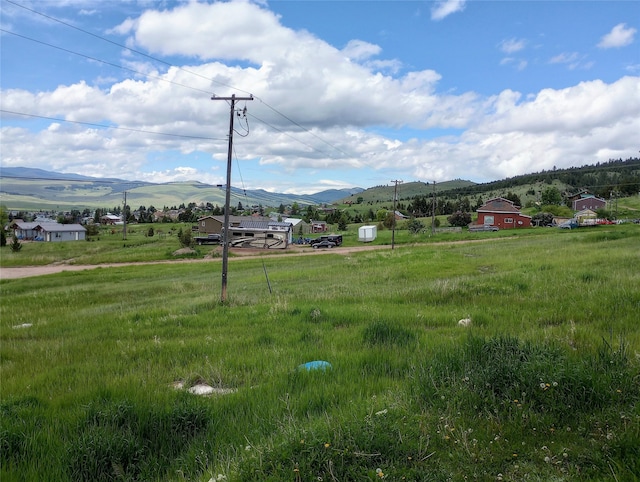 surrounding community with a rural view and a mountain view