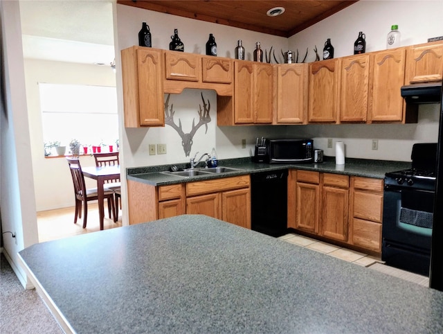 kitchen with light tile flooring, black appliances, sink, and fume extractor