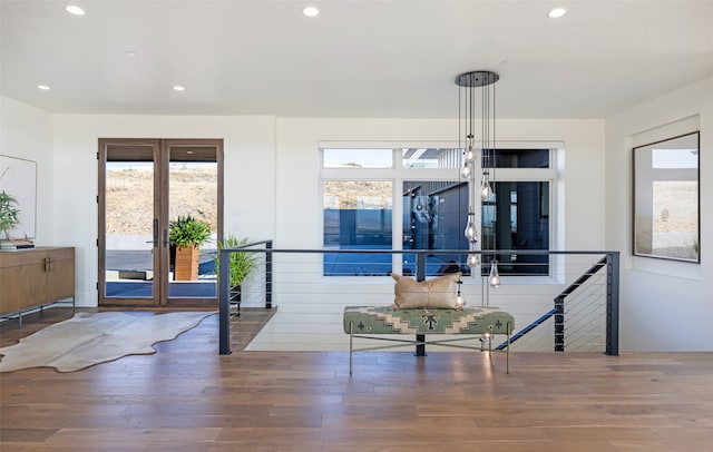 interior space with wood-type flooring and french doors