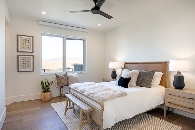 bedroom featuring hardwood / wood-style floors and ceiling fan