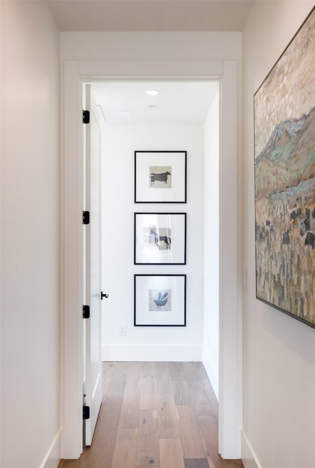 hall with light hardwood / wood-style flooring