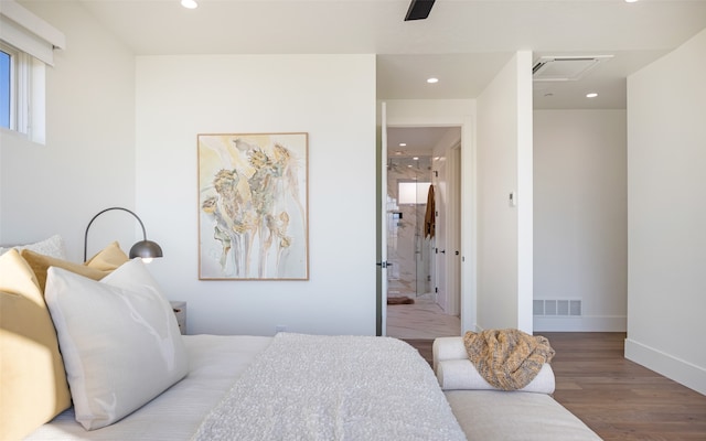 bedroom featuring wood-type flooring and ceiling fan