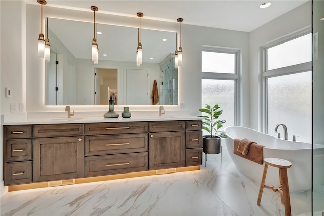 bathroom featuring vanity and a bathing tub