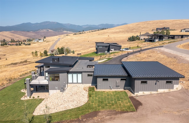 bird's eye view featuring a rural view and a mountain view