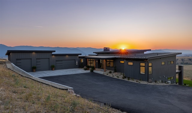 view of front of house with a mountain view and a garage