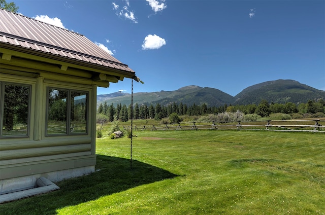 view of yard featuring a mountain view and a rural view