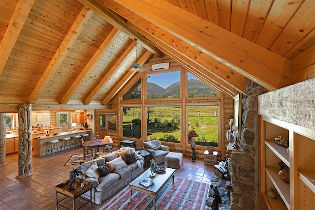 living room featuring beam ceiling, wood walls, a mountain view, wood ceiling, and dark tile floors