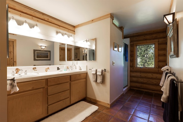 bathroom featuring tile floors, rustic walls, and double vanity