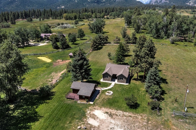 birds eye view of property with a rural view