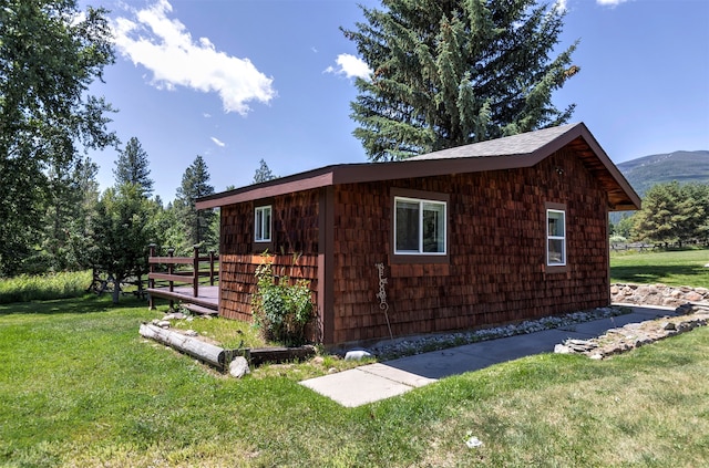 view of property exterior with a lawn