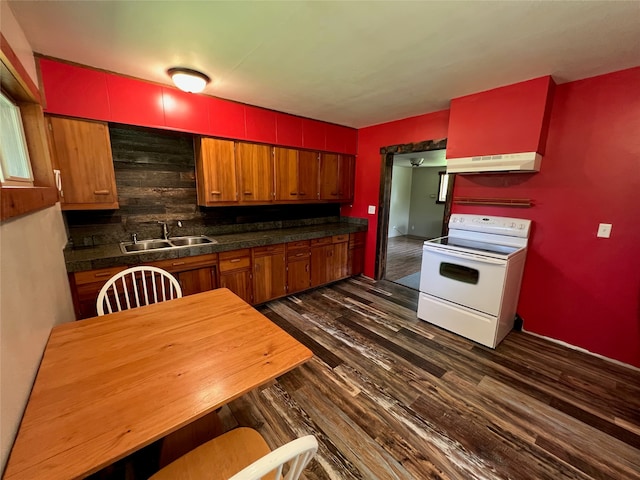 kitchen with electric stove, tasteful backsplash, sink, and dark hardwood / wood-style floors