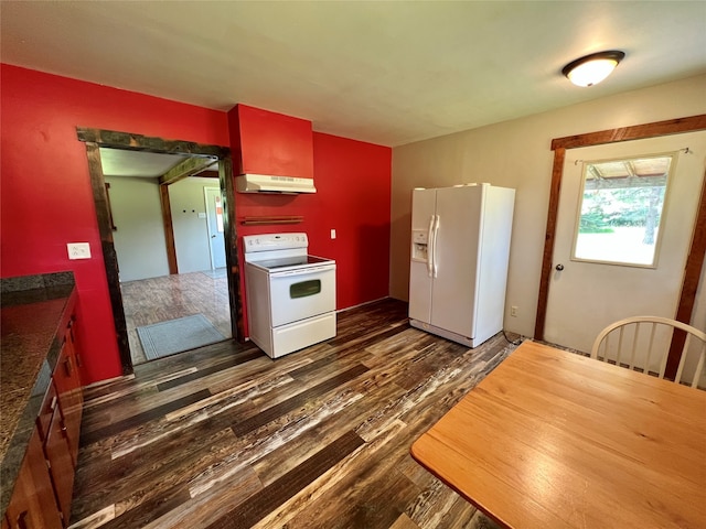 kitchen with dark wood-type flooring and white appliances