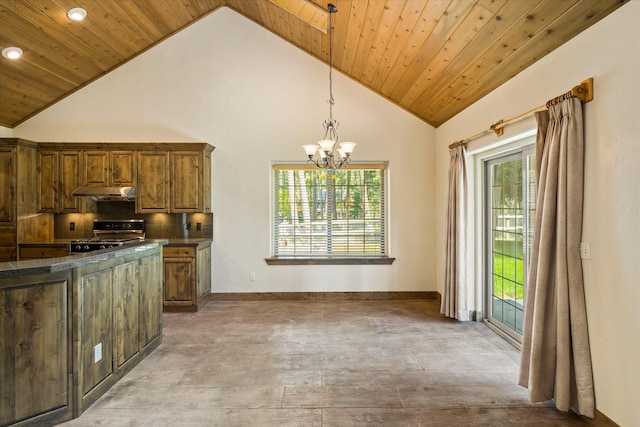 kitchen featuring high end stove, backsplash, a wealth of natural light, a chandelier, and wooden ceiling